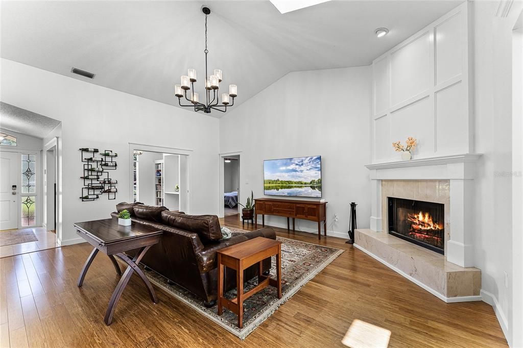 expansive family room featuring a wood-burning fireplace
