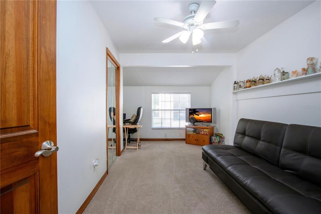 2nd bedroom with a built-in desk.