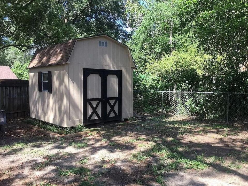 Small shed on other side of big garage. Offers even more storage!