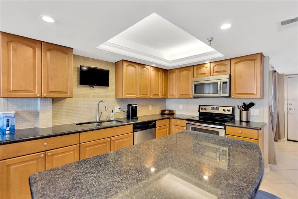 Expansive counter space, cabinets and even center island with storage will delight the Chef in you!