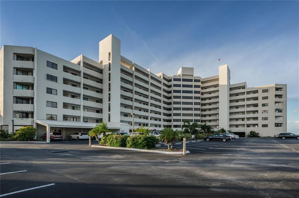 Panaramic view of building and open parking.