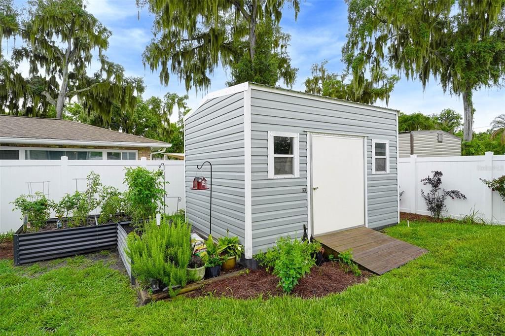 Lark Shed 14X10 Raised flower beds. New Custom privacy vinyl fencing ( MLS paperwork on file )