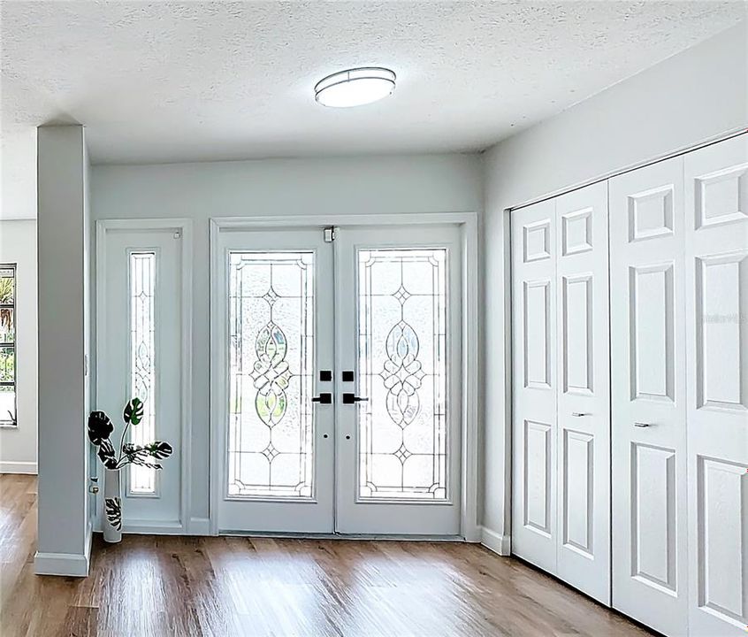 Inside entryway with coat closet