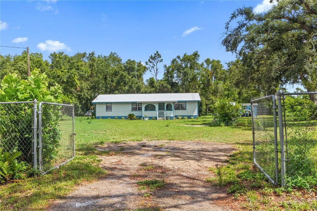 Initial view of the property standing outside of the fence.