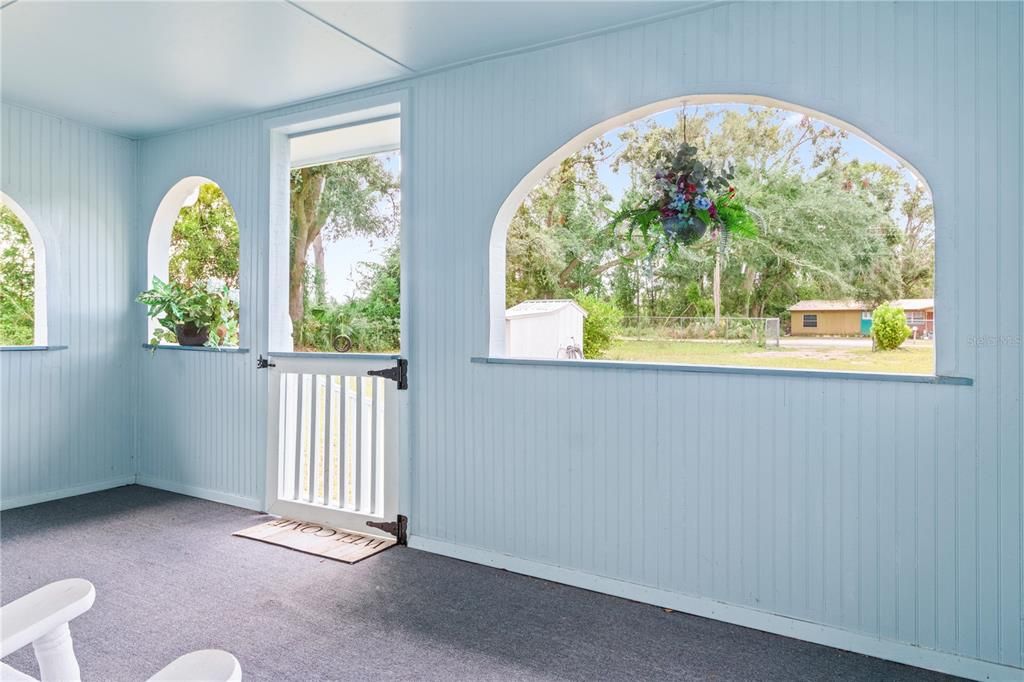 The front porch provides a panoramic view of the front yard.