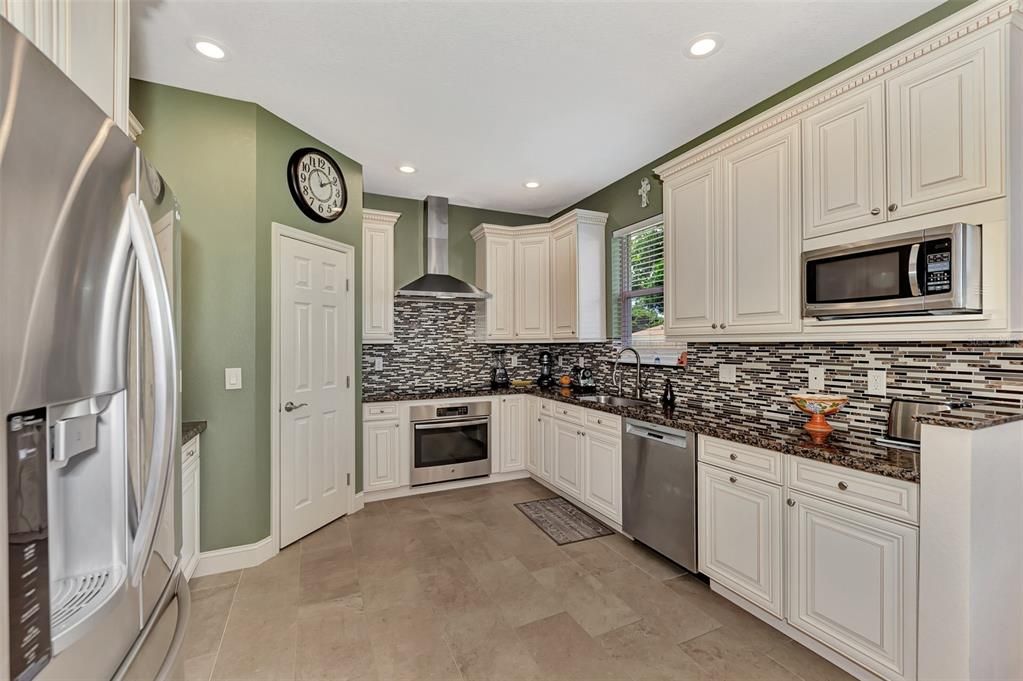 Modern Kitchen- Stainless steel appliances-Granite countertops- Large Corner Pantry-Tile backsplash