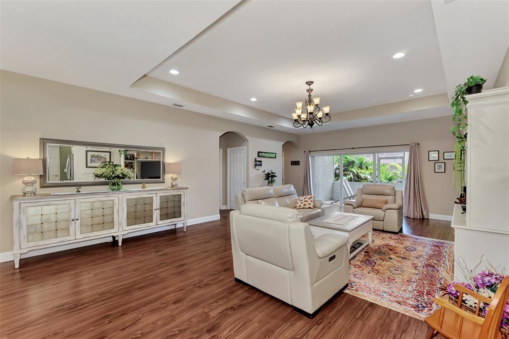 Living room-Enclosed lanai-Sliding french door windows-High ceilings-Tray ceilings-