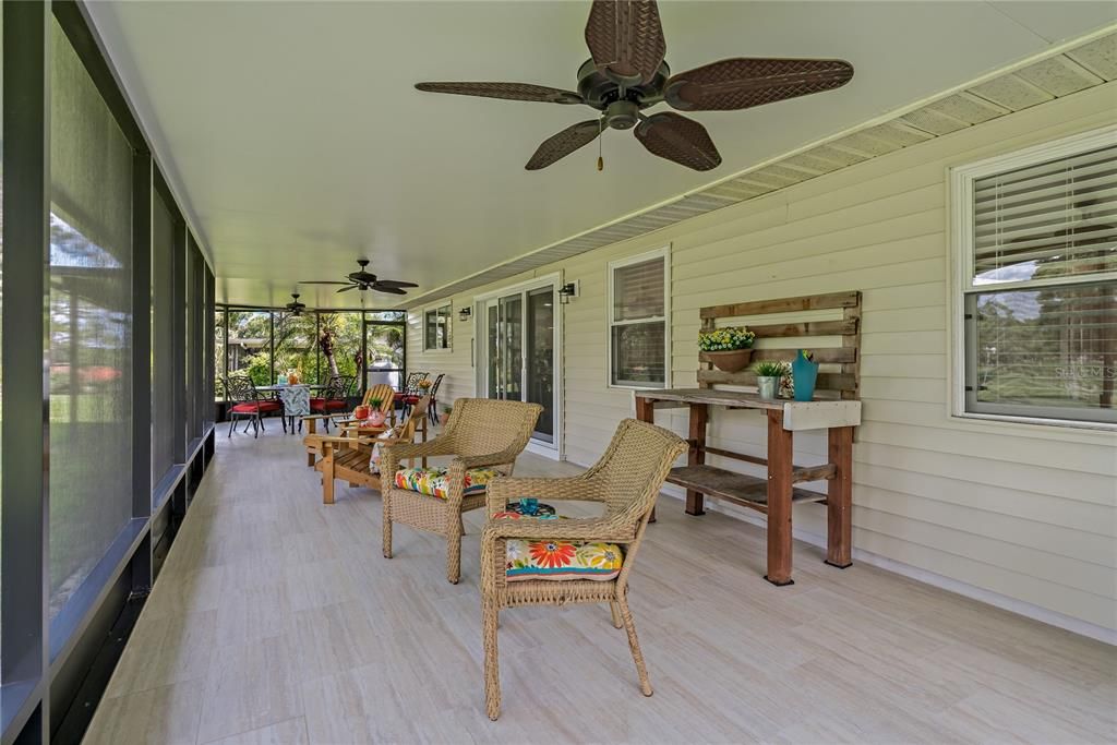 WOW! LOOK AT THIS EXPANSIVE, SCREENED IN, COVERED LANAI!