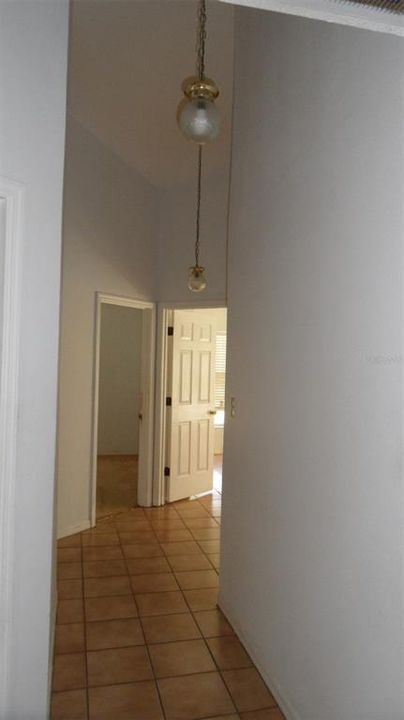 Hallway from Primary bedroom looking down the hallway to bedrooms #3 & #4 and also the laundry room.