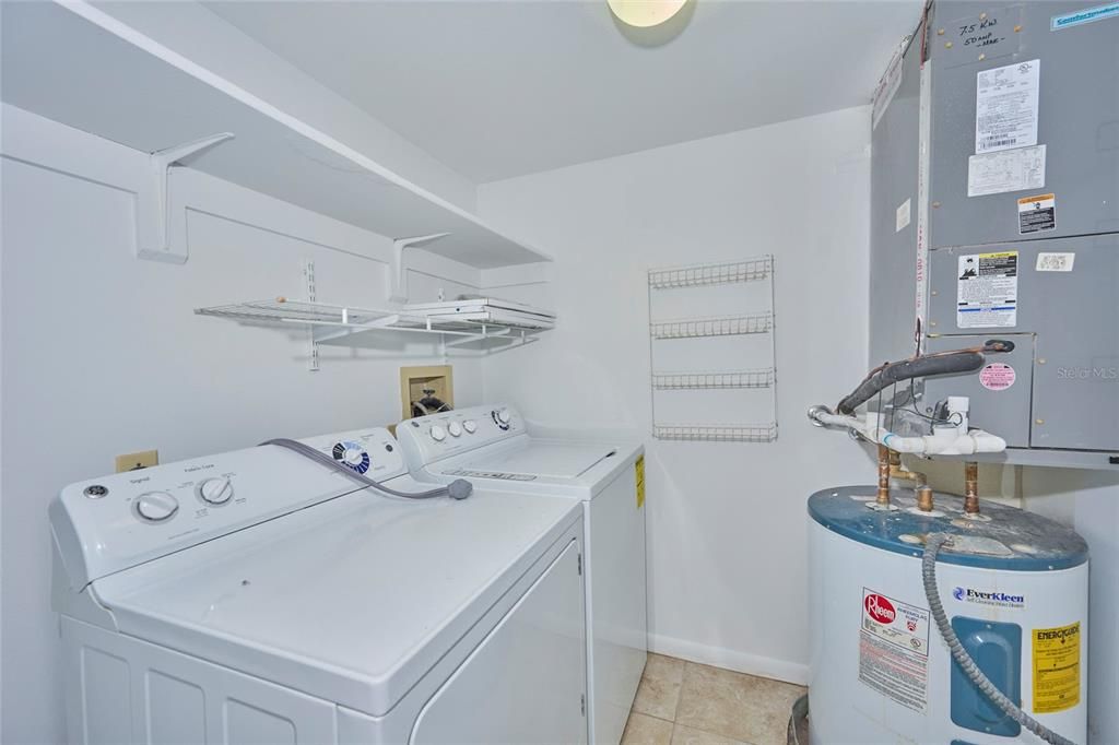 Inside laundry room with shelving