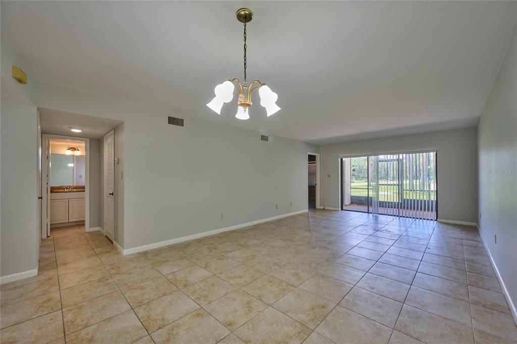 Guest hall to the left and large sliders to the lanai from the living room