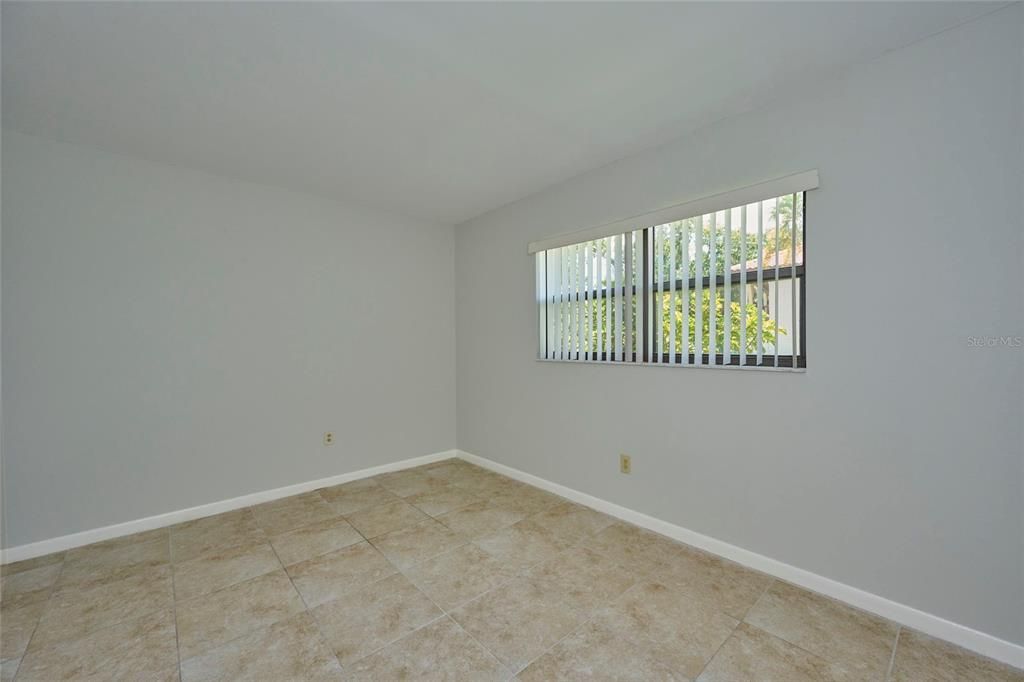 Guest bedroom with ceramic tile