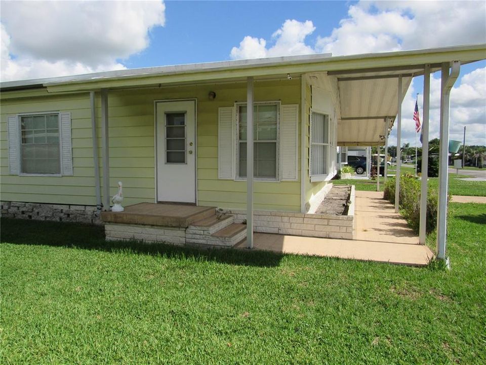 Covered side entry to Florida room.