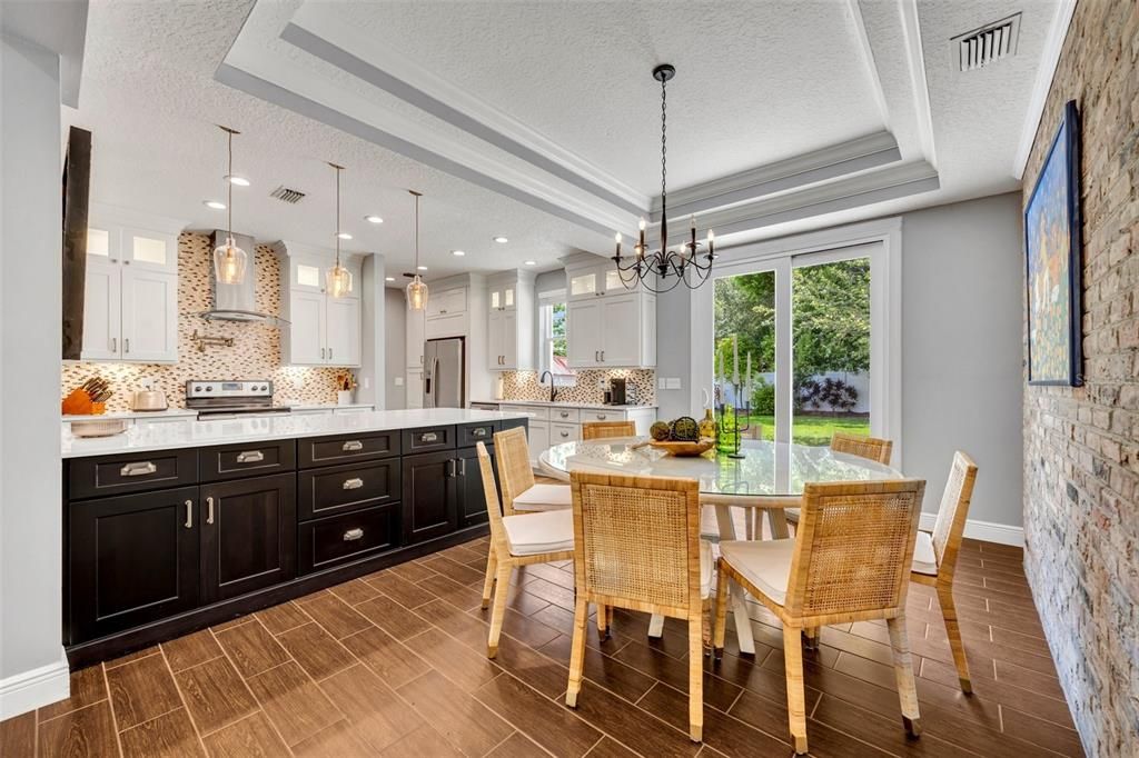 Dining Room with charming brick accent wall