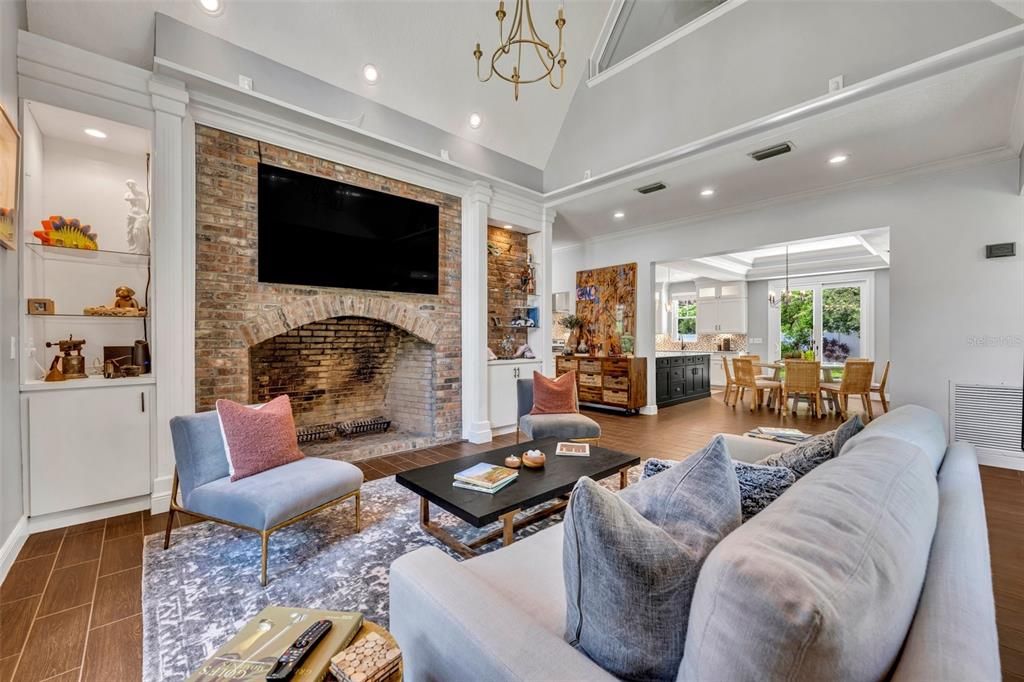 Living Room with huge brick Wood-burning Fireplace