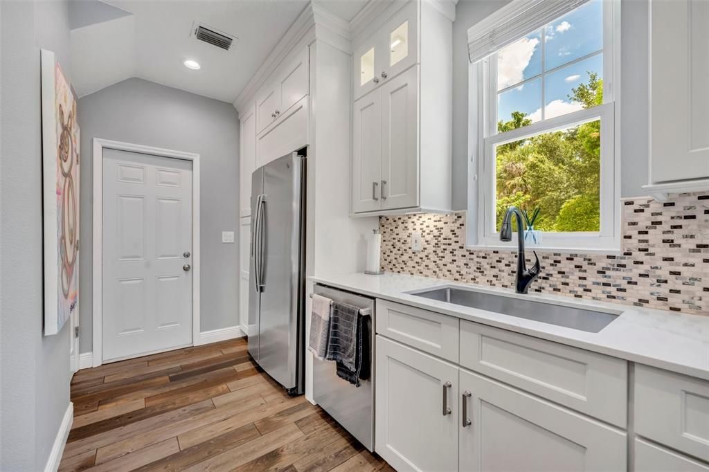 Light and Bright Kitchen with Window overlooking the backyard