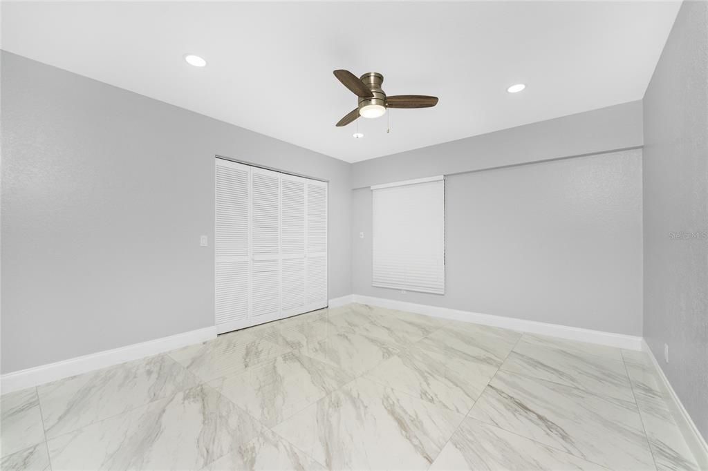 Guest Bedroom with closet and large window