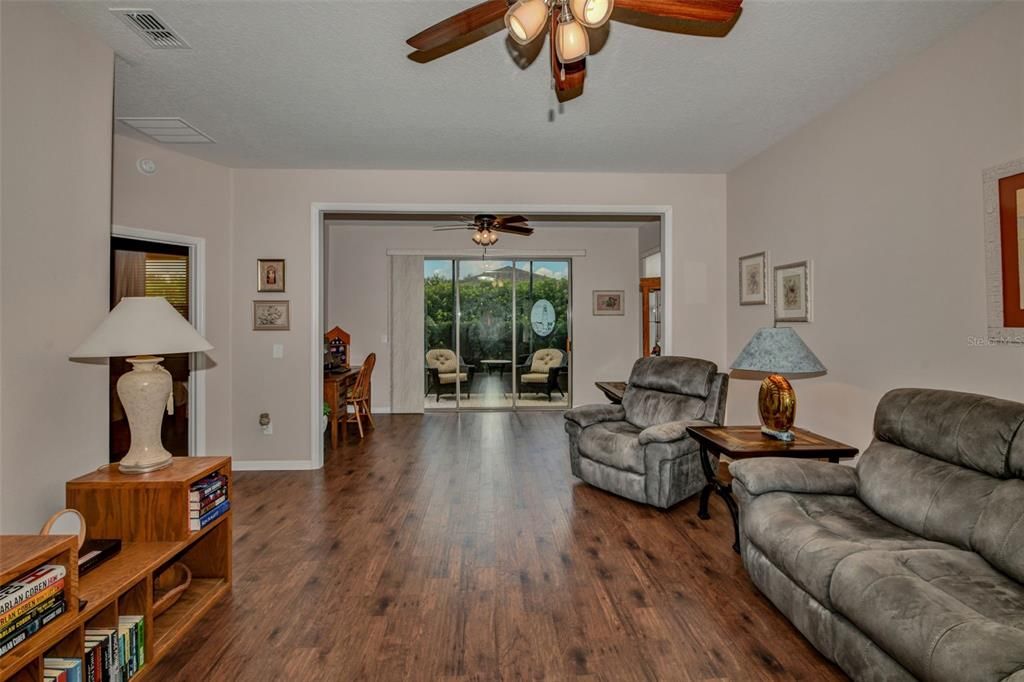 View of Living Room thru to Enclosed Lanai Area