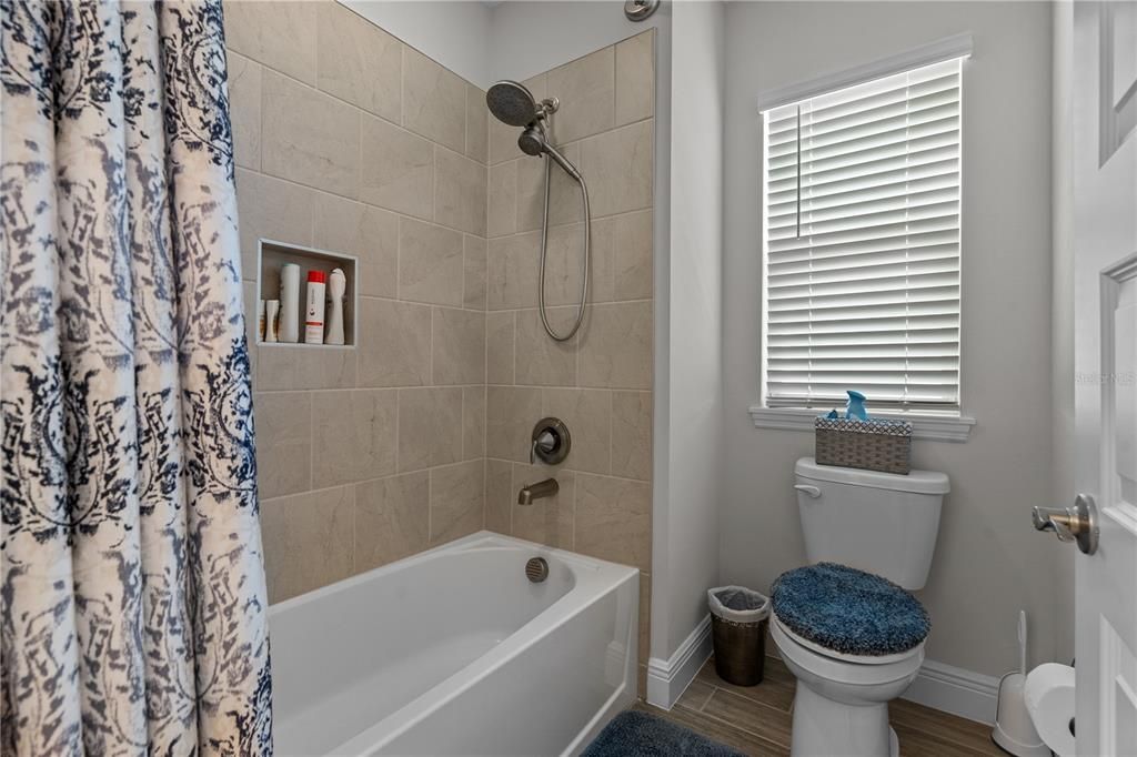 Shower closes off from vanity area