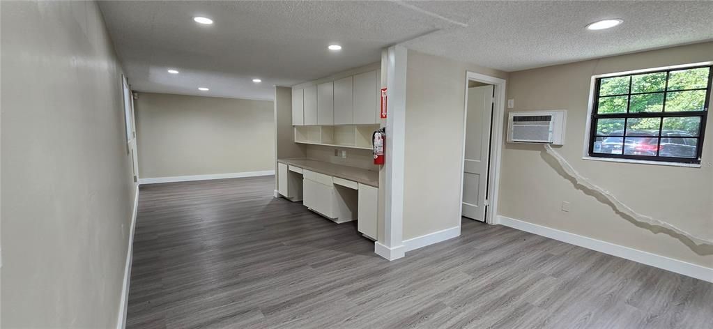Open office space to the right of reception with door to bathroom #3