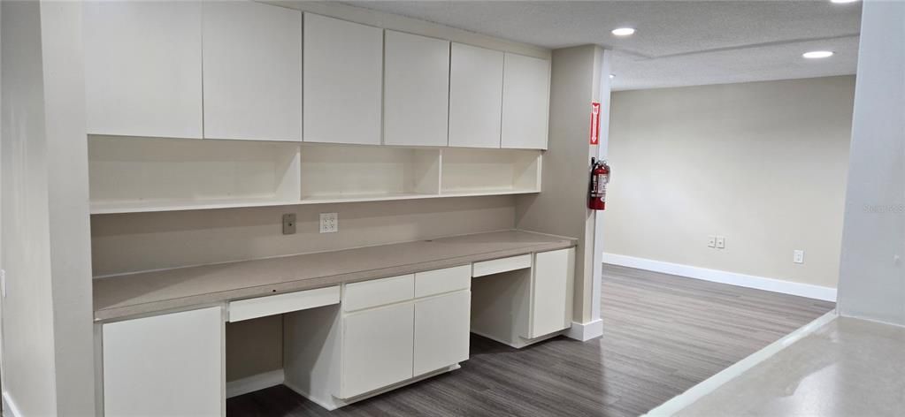 Built-in wall office desks and cabinets in reception
