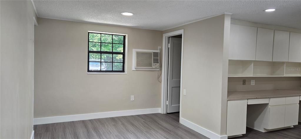 Open office space to the left of reception with door to bathroom #2