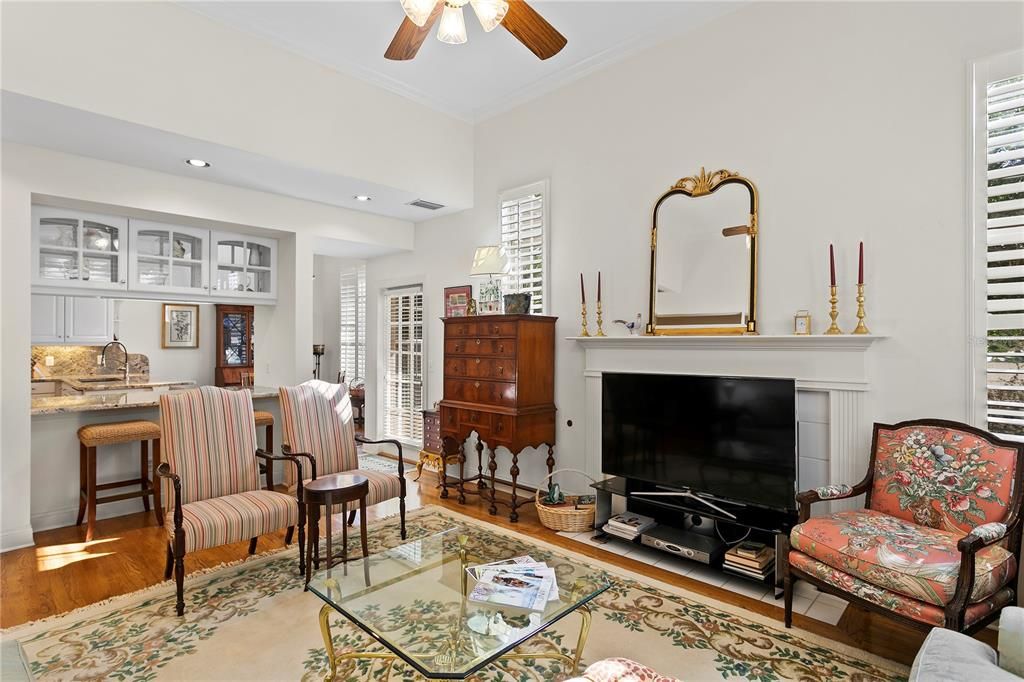 The spacious family room includes 11 foot ceilings, large windows and a gas fireplace.