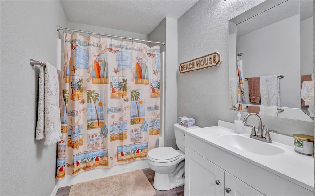 2nd bath with Tub shower and newer cabinets counter