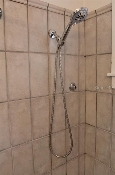 New Shower Head With Lower Head Hanger Attachment.