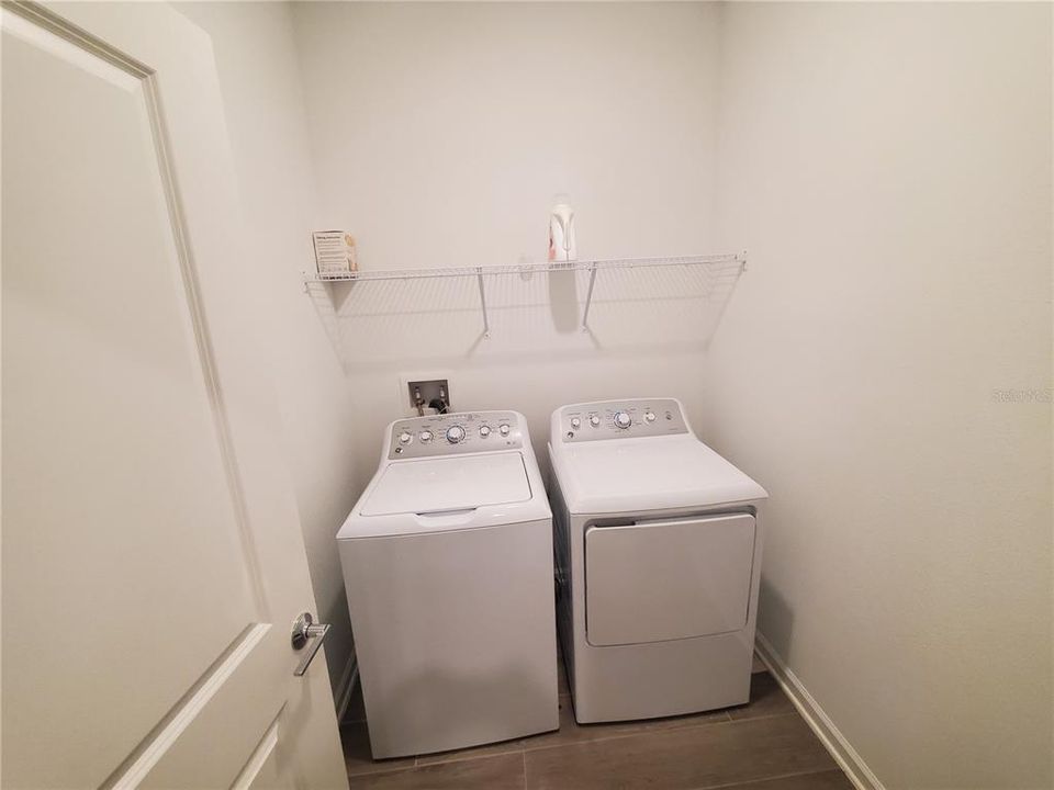 Washer and dryer is located in its own room off the kitchen.