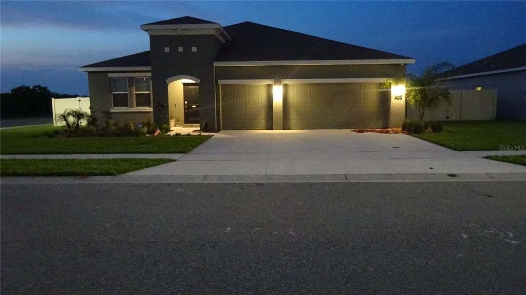 Night view of the front of the home. There are two light posts on the street plus the bright coach light makes it nice and bright in the evening hours.