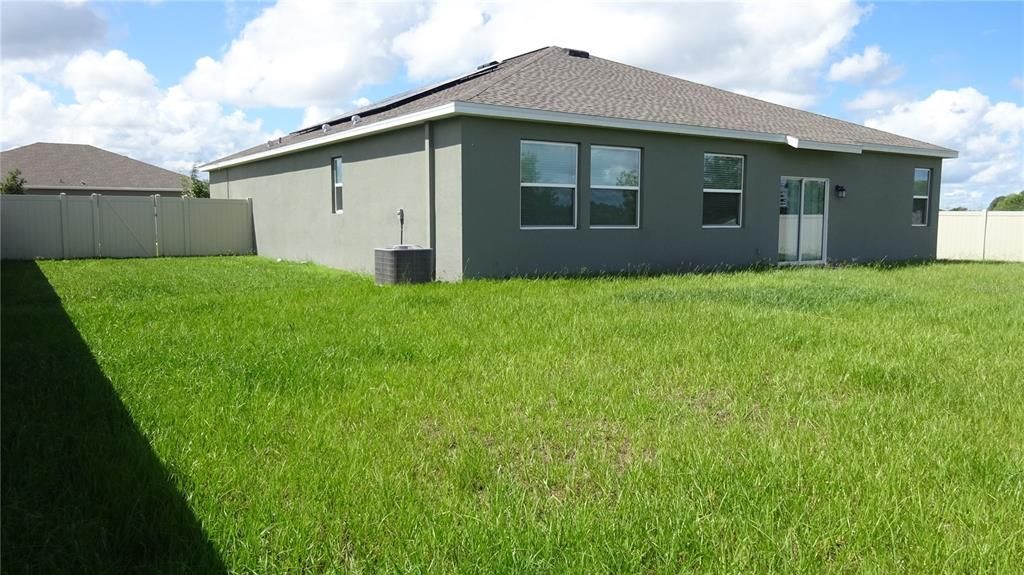 View of the home from the backyard.  Nice size backyard