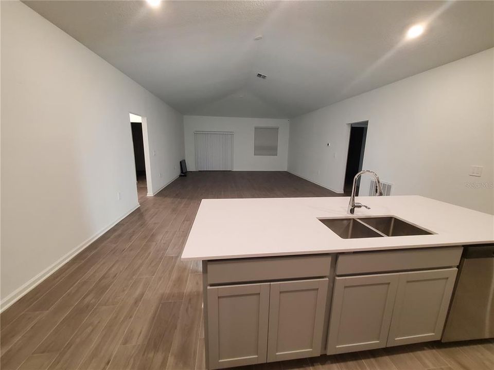 This is the view from the kitchen toward the dining area and Living room.  From the back wall of the kitchen to the window and sliding glass door is 37 feet.  This room measures 37 x 18.