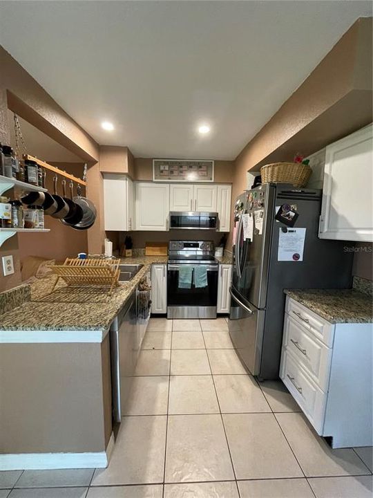 kitchen - granite counter tops - stainless steel appliances