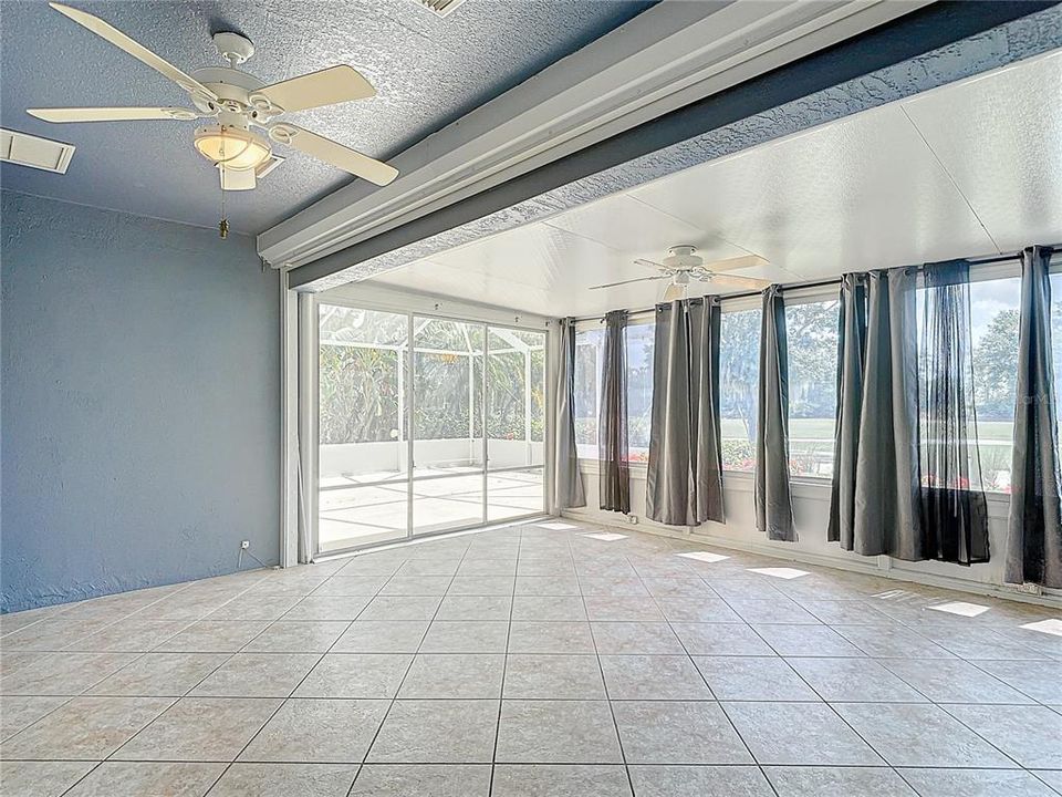 Expansive Florida room with triple slider.