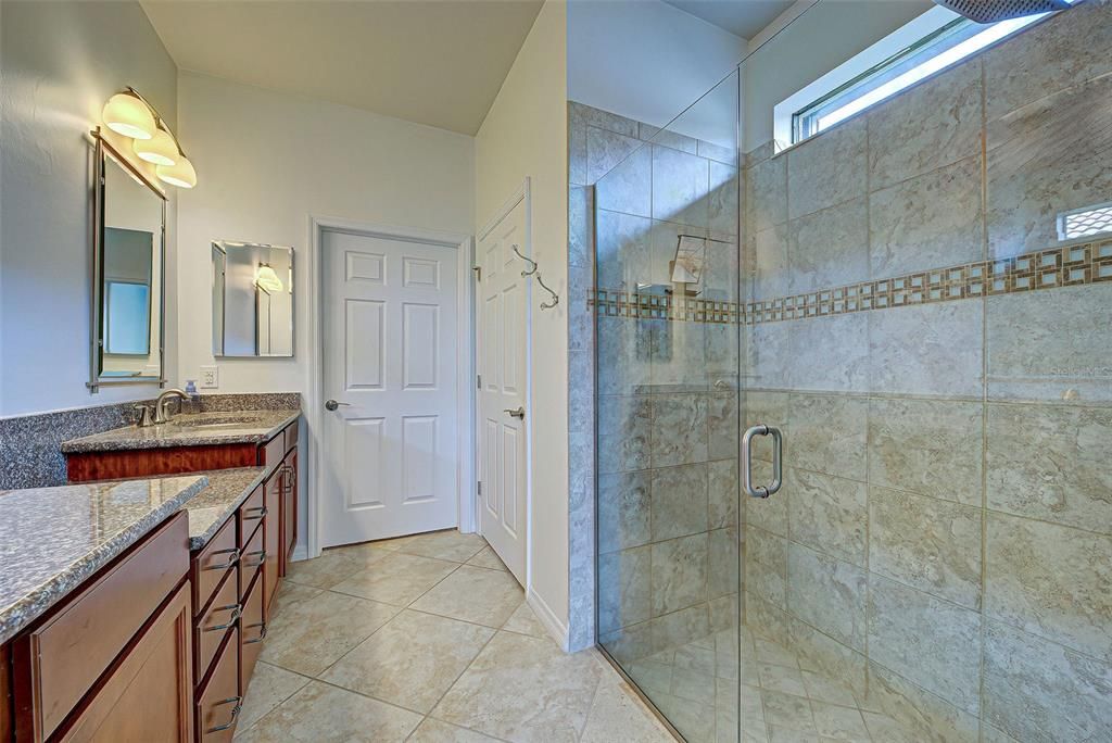 Upgraded glass shower door in primary bath