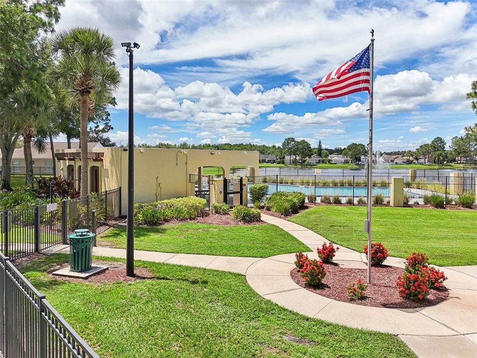 RESORT STYLE AMENITIES that include: a LARGE COMMUNITY POOL that OVERLOOKS an OVERSIZED POND, a WELL MAINTAINED REGULATION SIZE TENNIS COURT, a LARGE PLAYGROUND for ALL YOUTH AGES, an OPEN RECREATIONAL FIELD, PICNIC TABLES and STONE STATUES and a PLAQUE COMMERATING our UNITED STATES ARMED FORCES!