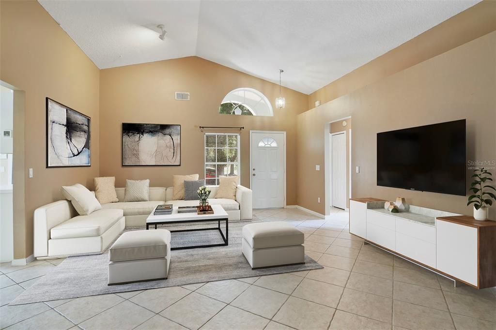 Formal living space greets you as you step through the front door and the natural flow brings you into the light and bright kitchen and family room. Virtually Staged.