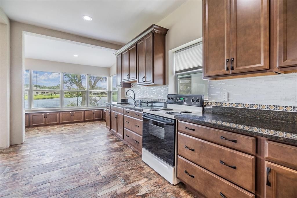 Patio Full Kitchen, tile flooring and views of the pond.