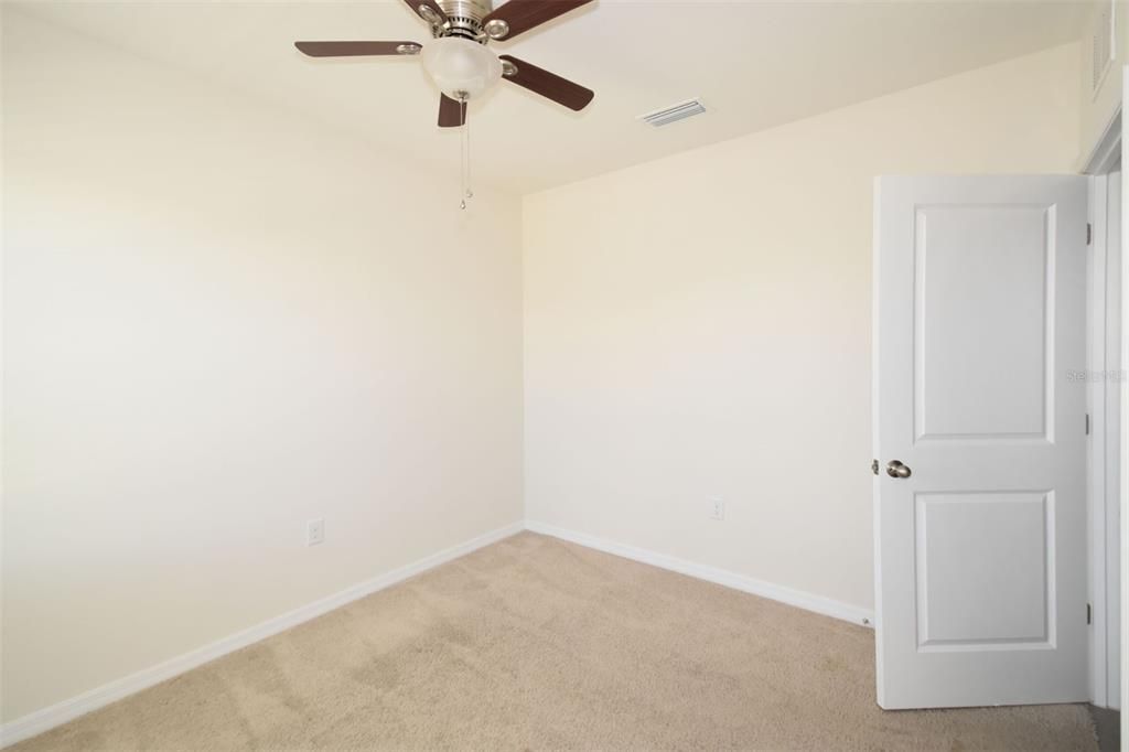 Bedroom 3 with carpet & ceiling fan