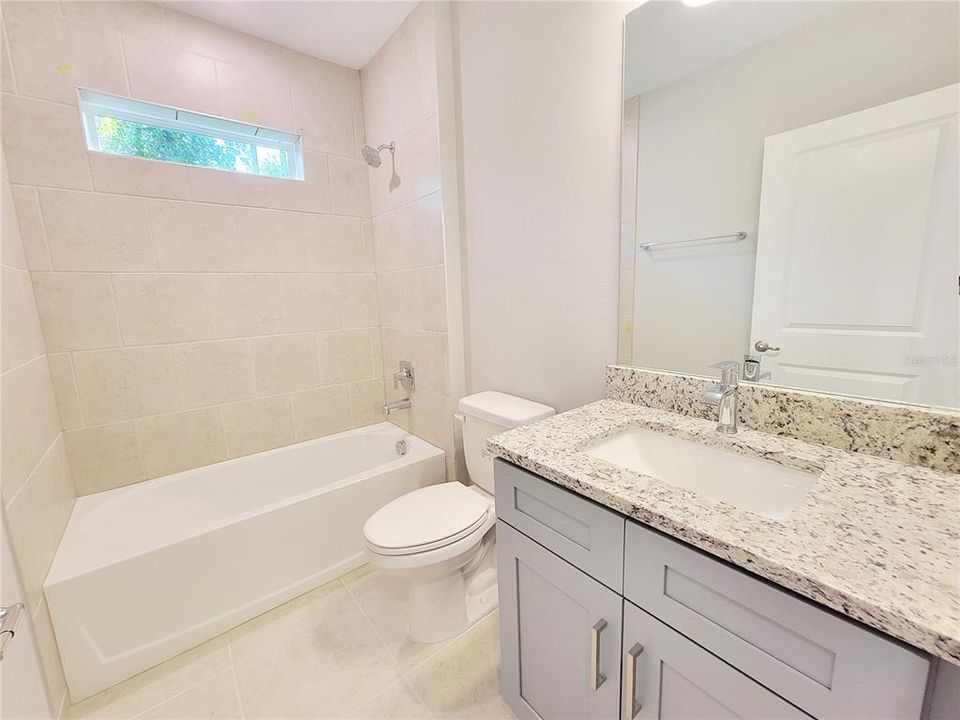 Shared bathroom with granite and tile shower!