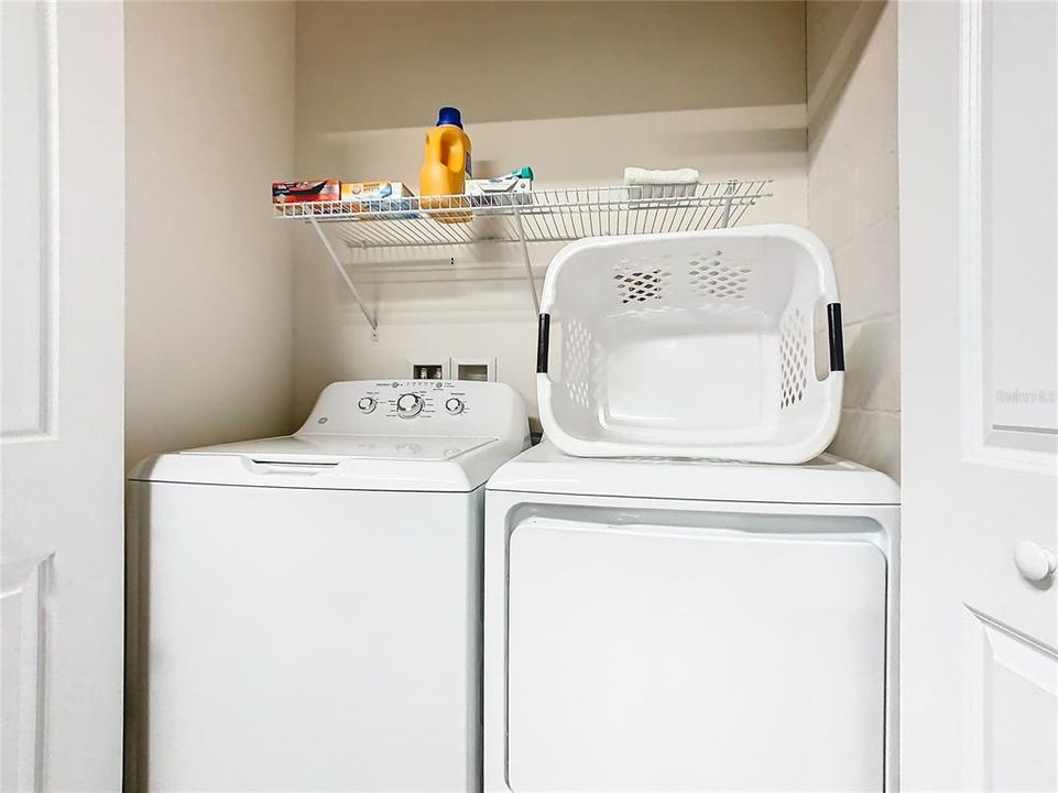 Laundry closet inside garage games room