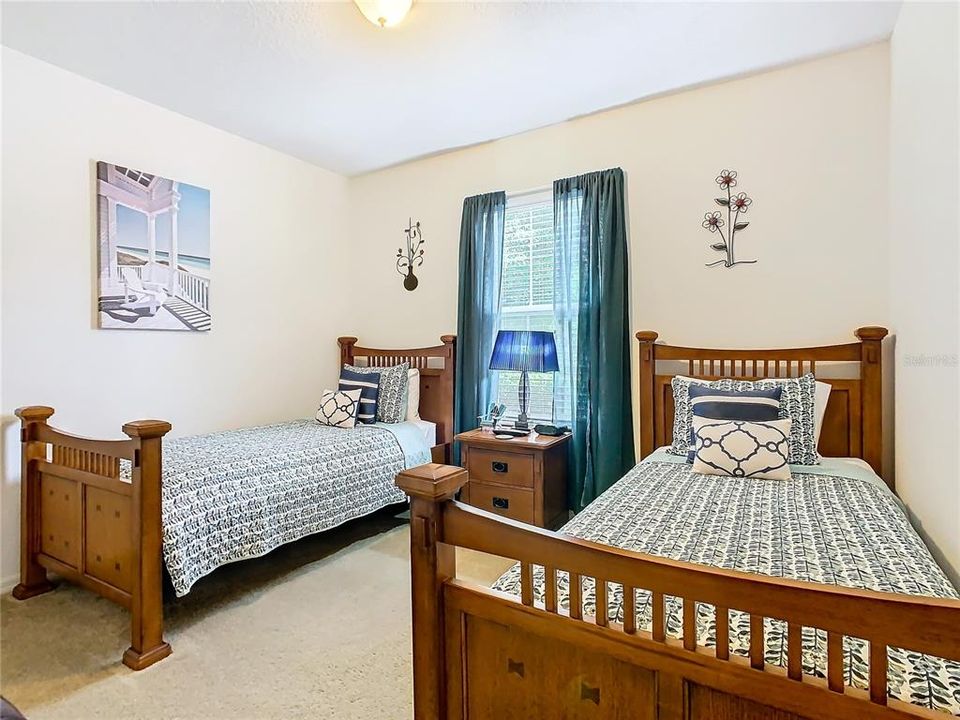 Bedroom 3 with twin beds overlook the front of the property