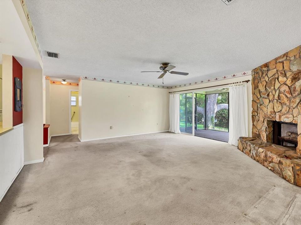 Living room opens to Lanai, Woodburning fireplace