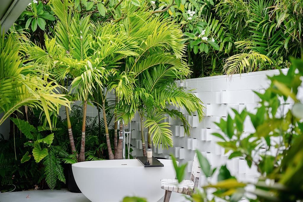 Private courtyard with outdoor soaker tub.