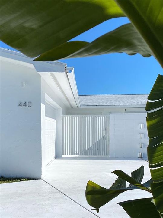 Gated courtyard entry.