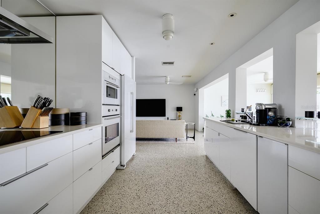 Kitchen with double wall ovens and ice maker.