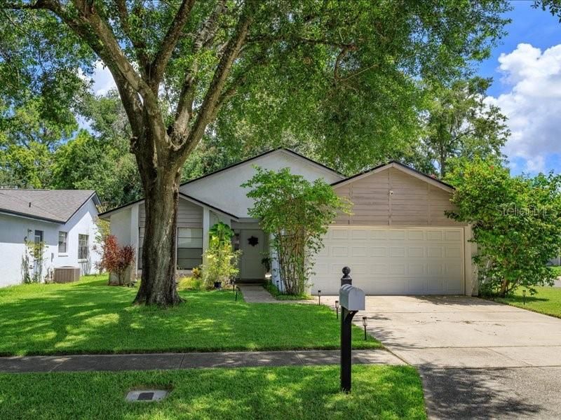 Inviting Entrance with Mature Landscaping.