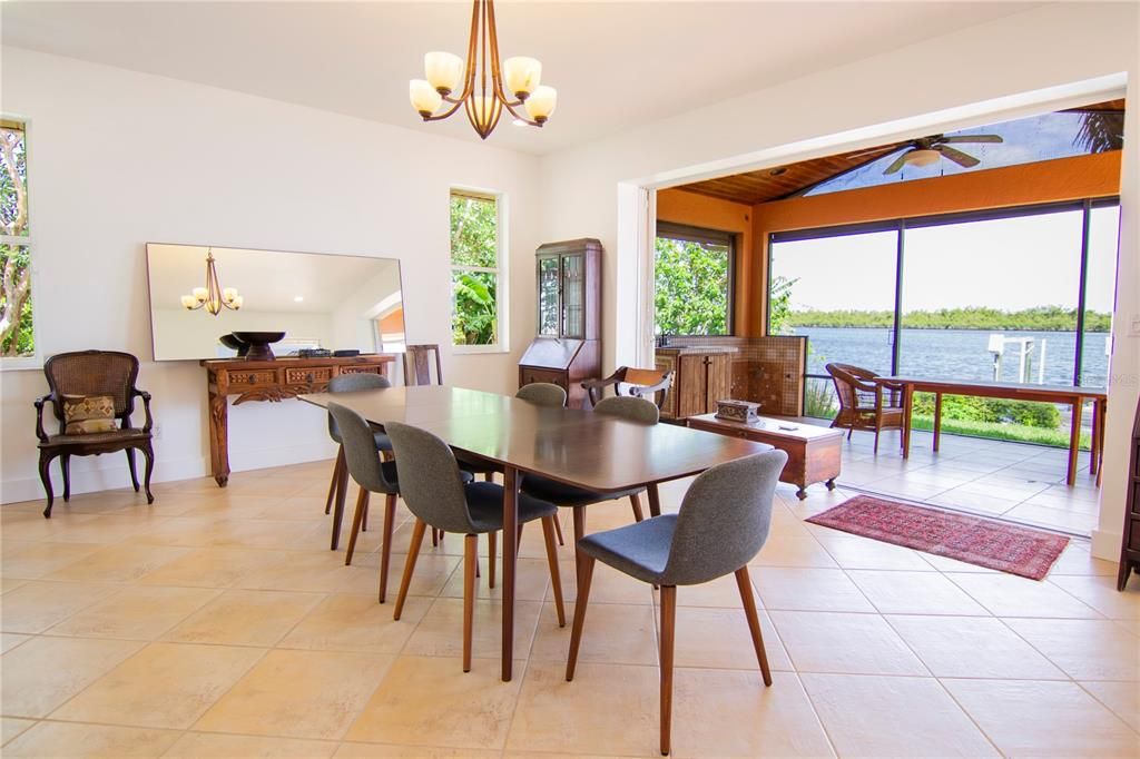 Dining room with retractable sliding glass doors