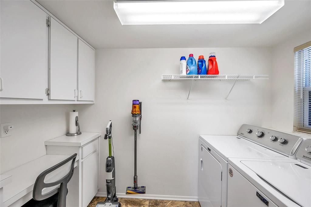Laundry room with cabinets and desk off Kitchen/Living Space